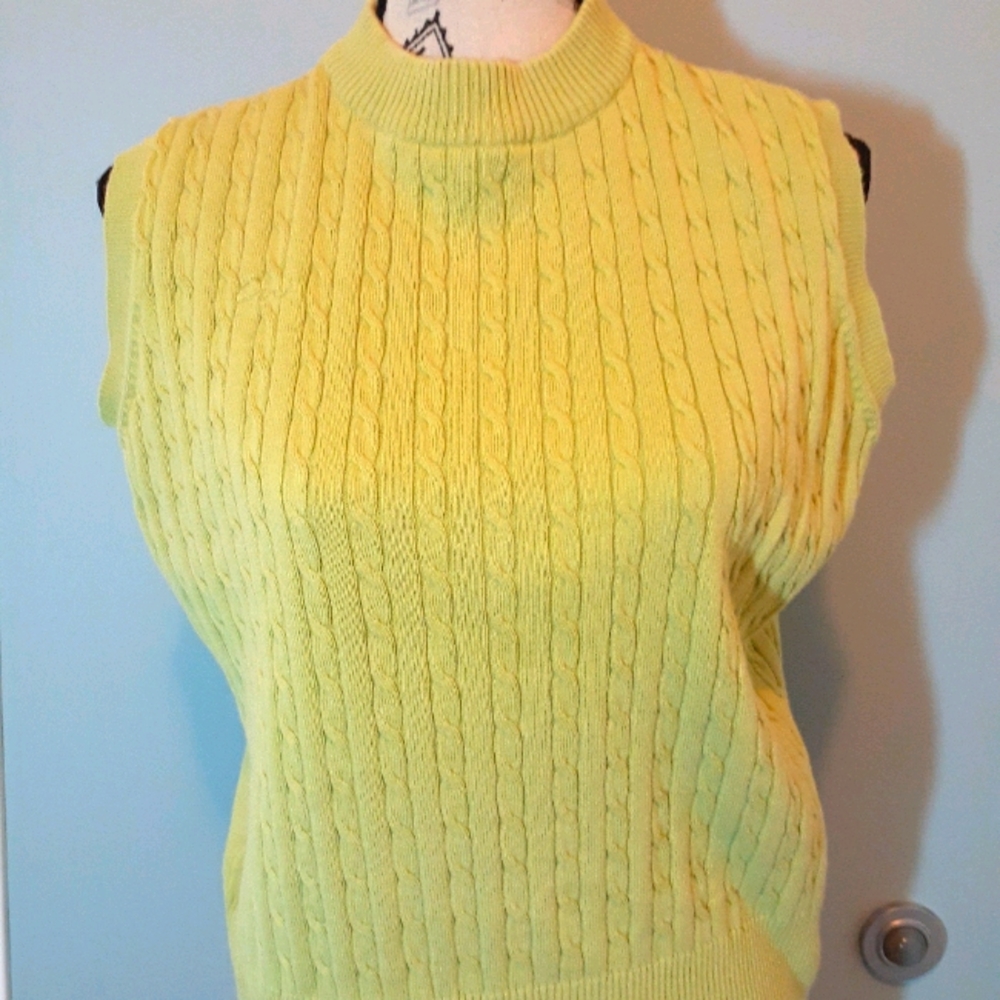 Green knit sweater vest.